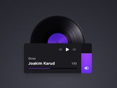 a black and purple business card next to an old record player's disc on a dark background