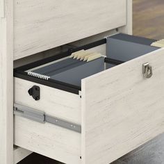 an open file cabinet with files in it