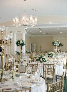 the tables are set with white and gold linens for an elegant wedding breakfasteon