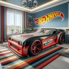 a bed room with a large bed and a hot wheels car on the wall