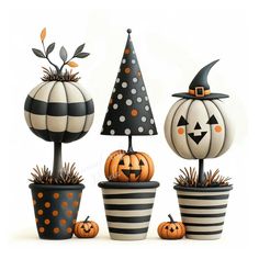 three pumpkins are sitting in black and white planters with decorations on them, one has a witch's hat