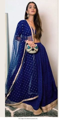 Bollywood Replica LehengaBollywood Model Blue color georgette designer lehenga With Digital Print With Heavy Sequence Work Border(Semi stitched : 5 mtr Flare With Cancan).Choli Fabric in Soft Georgette Fabric With Digital Print With Work Lace(Unstitched) Dupatta in Soft Net Fabric With Sequence Work. Semi stitched outfit that can be stitched to sizes till 42 inch size.Shipping time 5-7 days .Buy this Saree at Kollybollyethnics and make your occasion very special !!. With Express Free S Blue Sheer Dupatta Set For Navratri, Blue Georgette Anarkali Set With Cutdana, Blue Sharara For Navratri Reception, Blue Cutdana Sharara For Party, Blue Georgette Sharara For Reception, Blue Georgette Anarkali Set With Traditional Drape, Royal Blue Sharara For Navratri, Blue Choli With Sheer Dupatta For Navratri, Semi-stitched Blue Sets With Sheer Dupatta