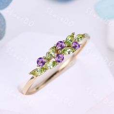 You are looking at a natural peridot and natural amethyst wedding ring.Vintage peridot wedding band,14k gold ring,cluster marquise peridot amethyst ring,August birthstone ring,stacking band,gift for women,Christmas gift You can choose the other side stone as you like: Alexandrite: www.etsy.com/listing/1506185634/vintage-peridot-wedding-band18k-solid? natural pearl: www.etsy.com/listing/1539377258/vintage-natural-peridot-pearl-wedding? Diamond/Moissanite: www.etsy.com/listing/1340984722/vintage-peridot-wedding-band14k-solid? Stone: *4x2mm marquise shaped natural peridot *2mm round cut natural amethyst. Metal *925 sterling silver  * Solid 10k 14k &18k. *Color:white gold,yellow gold,rose gold. Platinum Custom Order *The main stone can be other gemstones you can imagine,any birthstone can be m Peridot And Amethyst Ring, Amethyst And Peridot Ring, Peridot And Opal Ring, Peridot Wedding Band, Peridot Wedding Ring, Amethyst Wedding Ring, Peridot Rings, Amethyst And Peridot, August Birthstone Ring