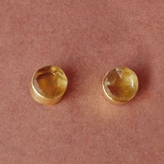 Wear a little drop of sunshine with this citrine gemstone and truly shine in this gold vermeil Studs. Rough gemstone glows brilliantly in these handmade solid brass studs. Go with this timeless chic piece and brighten up your wardrobe with this piece.  Natural Citrine Studs Earrings, November Birthstone Earrings, Bezel Set Post Earrings, High Quality Jewelry Making Suppliers Product Details Item Code: BJBE-0029 Stone Name: Citrine Stone Shape : Round Stone Size : 11mm Metal: 22k Yellow Gold Plat Gold Citrine Faceted Earrings, Gold Faceted Citrine Earrings, Gold Citrine Gemstone Earrings, Gold Earrings With Citrine Birthstone, Gold Citrine Earrings With Birthstone, Citrine Earrings Studs, Timeless Chic, Stud Earrings Gold, Birthstone Earrings