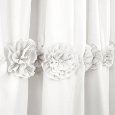 white curtains with flower decorations on them