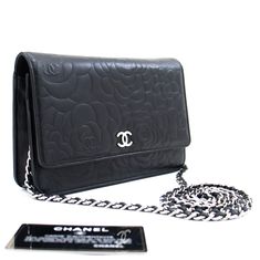 An CHANEL Black Camellia Embossed Wallet On Chain WOC Shoulder Bag k68 This item is Contemporary. The year of manufacture would be 2012.This browser is not supportedConditions & RatingsOutside material: LambskinColor: BlackClosure: SnapHardware and chain: Silver-ToneMade in FranceSerial sticker: AttachedSerial #: 17993335 (Same number on the sticker and the card.)Manufactured in 2013.Comes with: ity card, BoxOverall: 8 of 10 - The outside is in excellent condition with minimal signs of use only. Jimmy Choo Sunglasses, Wallet On Chain, Chain Silver, Trending Handbag, Dior Shoes, Hermes Bags, Chanel Black, Vuitton Bag, Fendi Bags