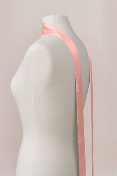 A chic accessory to dress up your bridal party or to glam up your wedding day look, this scarf can transition to any special occasion you are attending! Measures 86" in length and 2" in width. Pink Elegant Sash For Formal Occasions, Wedding Sash With Tie Back, Elegant Fitted Pink Sashes, Spring Party Fitted Sashes, Fitted Sashes For Spring Party, Elegant Pink Scarves For Wedding, Elegant Pink Satin Scarves, Fitted Bridesmaid Sash, Elegant Pink Satin Scarf