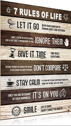 a wooden sign that says rules of life