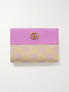 Gucci's wallet has been made in Italy from a combination of canvas-jacquard woven with the brand's iconic 'GG' monogram and smooth leather in a summery pink and yellow colorway. It has numerous slots for storing your cards and cash. Cute Card Wallet, Cute Designer Wallets, Designer Keychain Wallet, Gucci Designer Wallets With Logo, Designer Gucci Wallets With Logo, Luxury Gucci Wallet With Logo, Designer Rectangular Wallets With Logo, Gucci Travel Wallets With Card Slots, Gucci Wallets With Card Slots For Travel