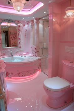 a bathroom with pink walls and flooring has a white toilet in the center of the room