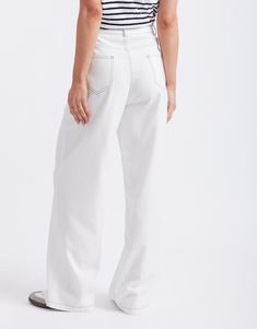 DESCRIPTION Elevate your wardrobe essentials with the Celeste Tencel Pants in White by 365 Days Clothing. These sleek pants are made from sustainable Tencel fabric, offering a luxuriously soft and breathable feel. Featuring a high-rise waist and a straight-leg fit, they provide a flattering silhouette while ensuring comfort. The classic five-pocket design is enhanced with contrasting stitching, adding a stylish touch to these versatile pants. Perfect for both casual and semi-formal occasions, th Solid Color High Rise Relaxed Fit Pants, High Rise Relaxed Fit Pants, White Mid-rise Bottoms For Work, White Mid-rise Workwear Bottoms, Versatile High Rise Pants With Elastic Waistband, Versatile White Wide Leg Pants, Modern Mid-rise White Pants, Solid Color Mid-rise Relaxed Fit Bottoms, Modern White Mid-rise Pants