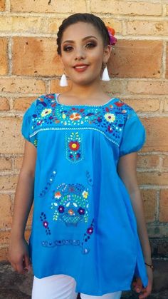 "Beautiful Mexican blouses embroidered! This blouses are great for hot summer. Fabric: poplin Care : hand wash only. EACH BLOUSE HAS UNIQUE EMBROIDERY. Blouses in pictures are just for display, the one I will be shipping to you might have different colorful embroidery. SIZES AND MEASUREMENTS: SMALL (4U-6US) Length: 26\" Armpit to armpit: 20\" MEDIUM (8US-10US) Length: 27\" Armpit to armpit: 21\" LARGE - (12US-14US) Length: 29 Armpit to armpit: 23\" EXTRA LARGE (16US-18US) Length: 30\" Armpit to Andrea Gutierrez, Mexican Blouses, Embroidery Blouses, Mexican Blouse, Colorful Embroidery, Unique Embroidery, Blue Yellow Red, Summer Blouses, Embroidered Blouse