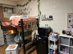 a dorm room with bunk beds and other items