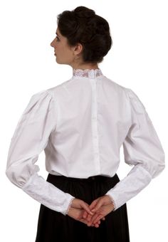 Perfect for an evening dinner with family and friends, this Victorian styled blouse will put you on the receiving end of numerous compliments! Charming cotton blouse has a cascading lacy jabot in front. The collar is trimmed in lace as well as the lace covered sleeves. Blouse has back button closure. Hand wash or machine wash gently. Tumble dry low or hang dry. 100% cotton. Poly lace trim. Koryn is wearing a skirt and brooch which are priced separately. Designed and made proudly by Recollections Elegant Cotton Lace Top With Ruffles, Formal Lace Collar Top For Fall, Classic Blouse With Lace Cuffs For Work, Classic Cotton Blouse With Lace Trim, Victorian Cotton Fitted Blouse, Fitted Victorian Cotton Blouse, Formal Lace Top With Lace Collar For Fall, Classic Lace Tops For Daywear, Formal Fall Lace Top With Lace Collar