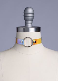 Classic o-ring choker collar made in holographic, iridescent pvc. This material is beautiful and color shifting, giving both 90s vibes and futuristic style. Fit is adjustable with buckle. Silver-toned nickel plated steel hardware. Holes reinforced with silver-toned grommets.Collar is 3/4 inches wide. SMALL/MEDIUM (11-13")MEDIUM/LARGE (13-15")LARGE/X-LARGE (15-17") Custom sizing available. All pieces are MADE TO ORDER. If your measurements fall outside these standards or you are unsure of what si Adjustable Rave Style Choker, Adjustable Multicolor Rave Choker, Fall Outside, Holographic Iridescent, O Ring Choker, Futuristic Style, 90s Vibes, Boho Fall, Choker Collar