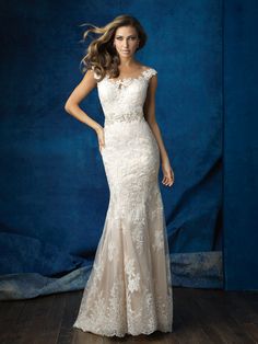 a woman in a wedding dress posing for the camera