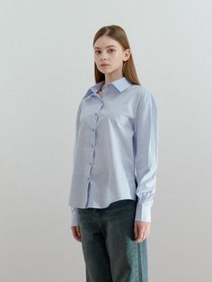 The ANC Collar Logo Shirt is a versatile piece that showcases Anoetic's embroidered logo on the collar, adding a unique touch to a classic shirt style.- Oversized fit for comfortable wear experience- Made of 100% cotton for a comfortable and stylish look- Suitable for various styling options to elevate your wardrobe Classic Blue Blouse For Everyday, Cotton Shirt For Everyday Wear, Collared Cotton T-shirt With Embroidered Logo, Cotton Collared T-shirt With Embroidered Logo, Blue Casual Shirt With Fold-down Collar, Washed Blue Button-up Shirt With Patch Pockets, Unstructured Indigo Button-up Shirt, Classic Shirt, Shirt Style