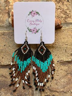 This item is in stock and ready to be shipped. Furthermore, it can also be picked up locally in Magnolia, TX. If you spend more than $99, the shipping costs will be covered by me! Elevate your boho style with these exquisite beaded earrings. Length 3.9” Bohemian Beaded Earrings With Large Beads For Summer, Bohemian Large Beads Earrings For Summer, Bohemian Large Beaded Earrings For Summer, Turquoise Beaded Earrings With Dangling Beads For Festivals, Bohemian Adjustable Beaded Earrings With Large Beads, Adjustable Large Beaded Earrings For Festival, Bohemian Beaded Fringe Chandelier Earrings As Gift, Bohemian Beaded Fringe Chandelier Earrings For Gift, Brown Dangle Beaded Earrings For Summer