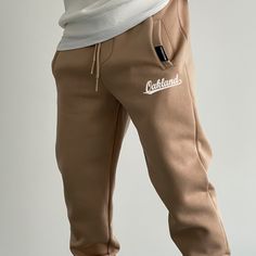 Oakland Fleece Sweatpants Sporty Beige Sweatpants For Streetwear, Winter Streetwear Beige Pants, Beige Winter Streetwear Pants, Winter Beige Streetwear Pants, Sportswear Pants With Pockets For Leisure, Leisure Sportswear Pants With Pockets, Leisure Sportswear Pants, Letter Print Long Pants, Winter Letter Print Pants