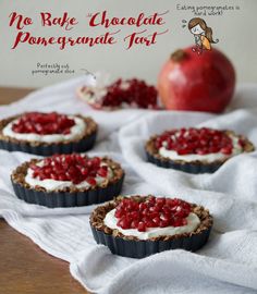 no bake chocolate and pomegranate tarts with an apple in the background