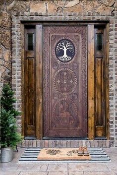 a wooden door with a tree on it