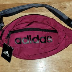 Adjustable Waistpack With Multiple Pockets For Storage. Adidas Nylon Sports Bag, Nylon Bags With Logo For Outdoor Activities, Outdoor Nylon Bags With Logo, Back To School Casual Pouch Bag, Casual Back To School Pouch Bag, Adidas Casual Bags For Outdoor Activities, School Nylon Bag With Logo, Casual Bags With Logo For Outdoor Activities, School Nylon Bags With Logo