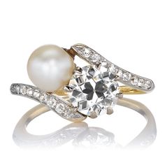 Romantic Vintage Saltwater Pearl and Old European Cut Diamond Toi et Moi Ring The Ellery ring is an authentic vintage pearl and diamond toi-et-moi ring from the Edwardian Era circa 1900. The ring features a GIA-certified 1.12-carat Old European Cut diamond of I color, SI1 clarity and a GIA-certified Natural Saltwater pearl. Along the shoulders are 18 Old Cut diamonds of approximately H-I color, totaling approximately 0.18 carats. The stones are set in a two-tone platinum and 18kt yellow gold set Wardrobe Wishlist, Saltwater Pearls, Vintage Pearl, Yellow Gold Setting, Edwardian Era, Pearl Set, European Cut Diamonds, Vintage Pearls, Gold Set