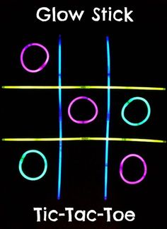 glow stick tic - tac toe game with neon colors on the black background