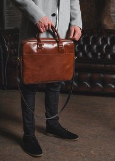 The leather brown briefcase for men, from ShLeatherBags, with simple, modern lines and timeless design features. The main spacious compartment has padding to better secure and protect your laptop and documents. Our messenger bag includes a removable shoulder strap and carrying handles for comfortable transportation. This minimalist briefcase is suitable for men and women. Ideal for work! EXTERIOR:- Genuine leather- Two handles- One shoulder removable belt- Large back pocket for magazines, newspa Mens Leather Bag Work Men's Briefcase, Men Work Bag, Laptop Bags For Men Style, Leather Laptop Bag For Men, Brown Briefcase, Brown Leather Laptop Bag, Mens Leather Laptop Bag, Leather Office Bags, Office Bags For Men