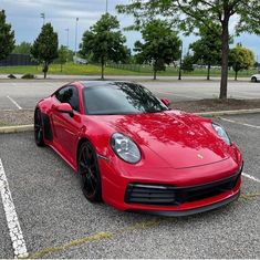 a red sports car parked in a parking lot