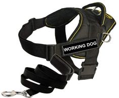 a black dog harness with the words working dog on it's chest and leash