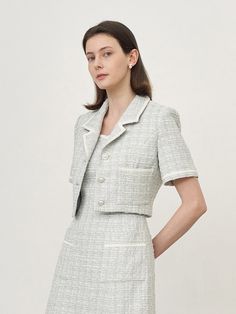 Editor's Notes The Monica Tweed Jacket is unique for its cropped length with button features along the front that pair perfectly with the matching tweed skirt sold separately. Dress for any formal occasion or dress down with denim jeans for a casual date look.- Accent buttons- Cropped length- Classic collar- Tweed material- Front pocket Measurements(in.)36 / 38- Total length: 15.35 in. / 15.75 in.- Shoulder: 14.96 in. / 15.35 in.- Chest: 18.11 in. / 19.29 in.- Waist: 14.17 in. / 14.96 Elegant Cropped Fitted Tweed Jacket, Elegant Fitted Tweed Cropped Jacket, Chic Fitted Tweed Cropped Jacket, Cropped Tweed Jacket For Work, Semi-formal Spring Tweed Blazer, Spring Semi-formal Tweed Blazer, Tailored Tweed Dress For Spring, Chic Cropped Tweed Jacket, Chic Spring Semi-formal Tweed Jacket