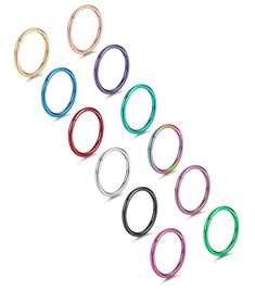 PRICES MAY VARY. 🌈Septum Piercing Jewelry Set🌈One order includes 12 pcs septum rings in 12 colors, simple and exquisite appearance, classic and fashionable design, perfect daily jewelry, suitable for men and women of any age, attracting more eyes on you ⭕Fine Workmanship⭕ Septum nose rings made of quality stainless steel, secure and improved hinged design, flexible click closure, convenient to open or close 👃Gauge Size👃1mm=18g, inner diameter 8mm, perfect size for women's and men's ear or no Seprum Ring, Cartilage Hoop Earrings, Piercing For Women, Septum Piercing Jewelry, Daith Jewelry, Septum Rings, Septum Nose Rings, Septum Piercings, Septum Nose