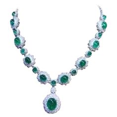 An exquisite design , very glamour and refined, by Italian designer , a very piece of art. Necklace come in 18k gold , with 18 pieces of natural Zambia emeralds, oval cabochon cut, fine quality , of 46,80 total carats. Pendant emerald is of 12,56 carats. Necklace come with natural diamonds of 13 carats,F/VS top quality. On this necklace , pendant is mobile, but on request , I can do fix . It is a high jewelry piece. Handcrafted by artisan goldsmith. Excellent manufacture and quality. Complete wi Fairy Jewelry, 18k Gold Necklace, Zambian Emerald, Expensive Jewelry, 18k Gold Ring, Italian Designer, Zambia, Emerald Diamond, High Jewelry