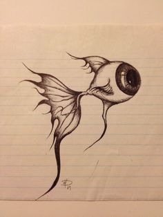 a drawing of a fish with an eye on it's head and tail, sitting on lined paper