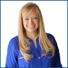 a woman with long blonde hair wearing a blue scrub suit and smiling at the camera