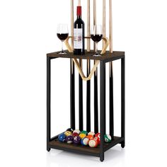 a rack with pool balls, wine glasses and candles on it is shown in front of a white background