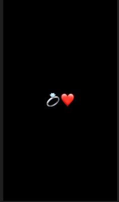 two red hearts are sitting next to each other on a black background with the word love written