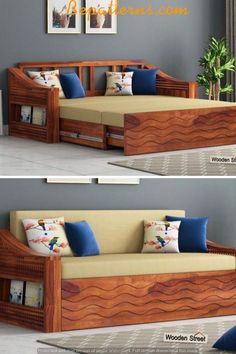 a couch that is made out of wood and has blue pillows on the bottom half