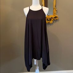 Asymmetrical Black Dress! Very Soft And The Perfect Length. Can Be Dressed Up Or Down. Casual Maxi Dress With Asymmetrical Hem For Night Out, Chic Flowy Mini Dress With Asymmetrical Hem, Black Maxi Dress With Asymmetrical Hem For Date Night, Black Midi Dress With Handkerchief Hem For Party, Flowy Dress With Asymmetrical Hem For Night Out, Asymmetrical Black Maxi Dress For The Beach, Asymmetrical Black Maxi Dress For Beach, Black Summer Dress With Curved Hem, Black Beach Midi Dress With Asymmetrical Hem