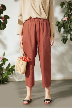 "Another pair of pants you will fall in love with. Just right voluminous, slightly cropped, the wider leg opening compared to our tapered pants, and front seaming details, all these features make this linen pants comfy and chic. * Prewashed medium weight linen * Slightly drop crotch * Comfort mid-rise * Cropped&wide leg * Two deep side pockets * Elastic waistband * Front leg seaming details * Listing colors: Black and Terracotta Please provide your natural waist, lower hip measurements and y Linen Bottoms With Elastic Waistband For Fall, Non-stretch Linen Harem Pants For Spring, Spring Linen Harem Pants With Pockets, Fall Linen Bottoms With Elastic Waistband, Casual Linen High-waisted Wide Leg Pants, High-waisted Linen Pants For Daywear, Fall Wide Leg Linen Pants With Elastic Waistband, Casual Linen Harem Pants With Elastic Waistband, Linen Wide Leg Pants For Fall