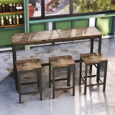 three stools and a table in front of a window with bottles on the shelves