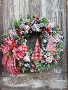 a christmas wreath with red and white decorations