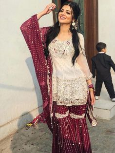 a woman in a red and white outfit