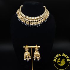 Beautiful Polki kundan hasli style necklace with jhumka Elevate your style with the exquisite Diva necklace and earring set, exclusively available at our luxury Indian jewelry store. Made with the finest materials, this set is a true reflection of Elegance and glamour, designed to take your look to new heights. Each piece in the set is meticulously crafted to ensure superior quality and attention to detail. The necklace and earring set is the perfect addition to your collection offering versatil Dual-tone Kundan Chandbali Bridal Necklace, Dual-tone Chandbali Kundan Bridal Necklace, Bollywood Style Kundan Bridal Necklace In Dual-tone, Bollywood Style Dual-tone Kundan Bridal Necklace, Diwali Designer Jewelry With Latkans, Dual-tone Kundan Bollywood Necklace, Dual-tone Bollywood Kundan Necklace, Designer Chandbali Necklaces For Diwali, Bollywood Style Dual-tone Kundan Necklace