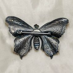 "Antique French brooches, butterfly shape brooches, large butterfly silver color, small butterfly gold color vintage brooch Valentine gift DESCRIPTION: Very lovely antique French brooches made from silver and gold color metal, both brooches are shaped as butteflies, the silver color butterfly is larger than the gold color butterfly brooch, you can choose at moment of order which one to buy. HOW TO USE IT: A really nice antique brooh to collect and to wear! Perfect gifgt for Valentine Day! CONDIT Elegant Collectible Butterfly Brooches, Elegant Butterfly Brooch For Collectors, Elegant Butterfly Brooches For Collectors, Elegant Butterfly Brooch, Elegant Silver Butterfly Brooches, Elegant Silver Butterfly Brooch, Vintage Handmade Butterfly Brooch, Handmade Vintage Butterfly Brooch, Antique Silver Butterfly Jewelry