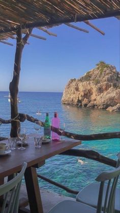 an outdoor dining area overlooking the ocean