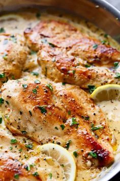 chicken with lemons and parsley in a skillet