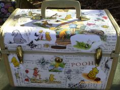 an old suitcase with winnie the pooh pictures on it