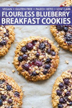 four blueberry breakfast cookies on top of parchment paper with the words, flourless blueberry